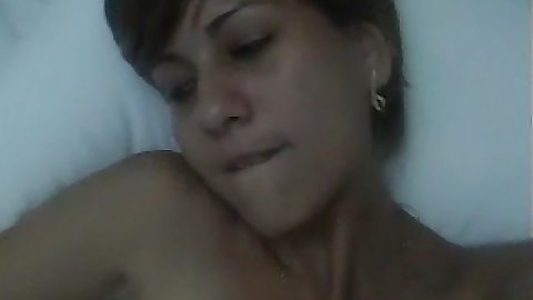 Chick filming herself as she plays with her own body