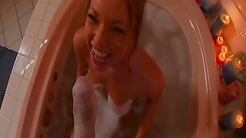 Hot babe sucks off her bf in the bathtub foam