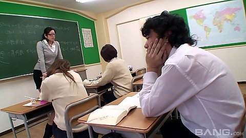 Teacher in class with asian Naomi Asakura