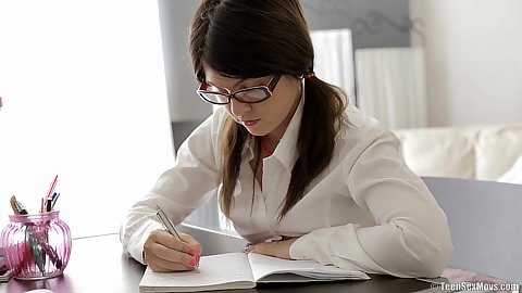 Dreamy 18 year old nerdy teen Mackenzie doing some homework and getting clothes taken off