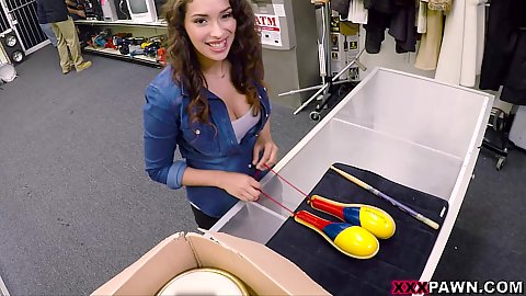 Smiling brunette girl Kitty Catherine in a public place at our pawnshop looking to sell some stuff