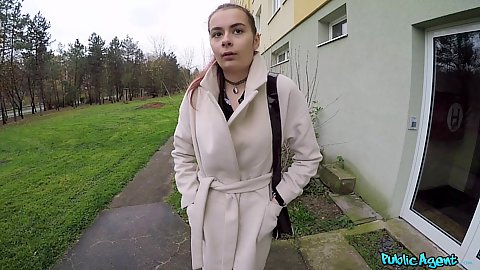 Scyley Jam wearing a coat outdoors and is a student from Russia we explain our situation and offer money