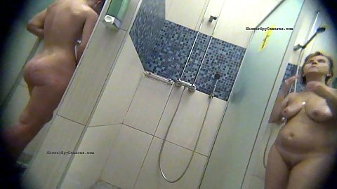 Women coming up one by one getting undressed and using soap to clean themselves off in the shower for spy camera