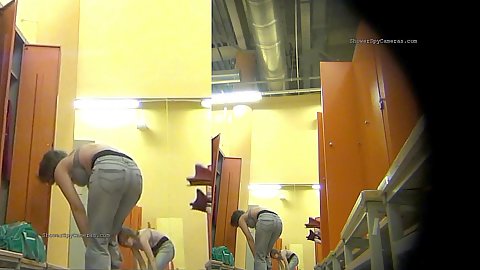Newly installed spy camera in the womens changing room showing naked slim and fat ass women getting changed