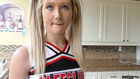 18 year old cheerleader in uniform in the kitchen talking and masturbating on camera April Aniston