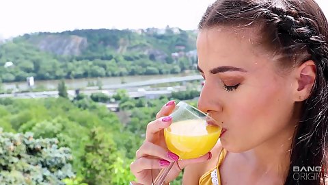 Sipping on her orange choose tiny boobed solo brunette Eveline Dellai heads into shower to take a quick bath and play with herself