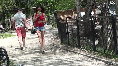 Miniskirt wearing brunette good looking girl with flowers in public Henessy goes into our live studio to strip naked and show boobies