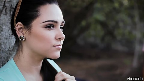 Brunette pretty looking romantic girl outdoors in the public park Zoey Foxx catches the man watching her body