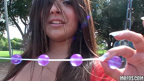 Babe in a red dress fists ourself on a public playground