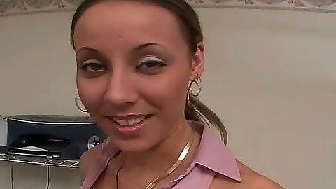 Brunette Delilah Strong undressing and masturbating on office chair