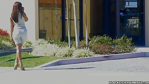 Ebony babe Dee Rider posing outdoors and grabbing black cock