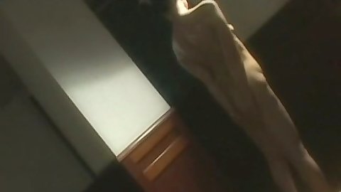 Asian amateur girl rolls around the floor solo