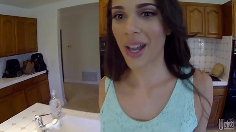 Brunette Leilani Gold walking around in a dress